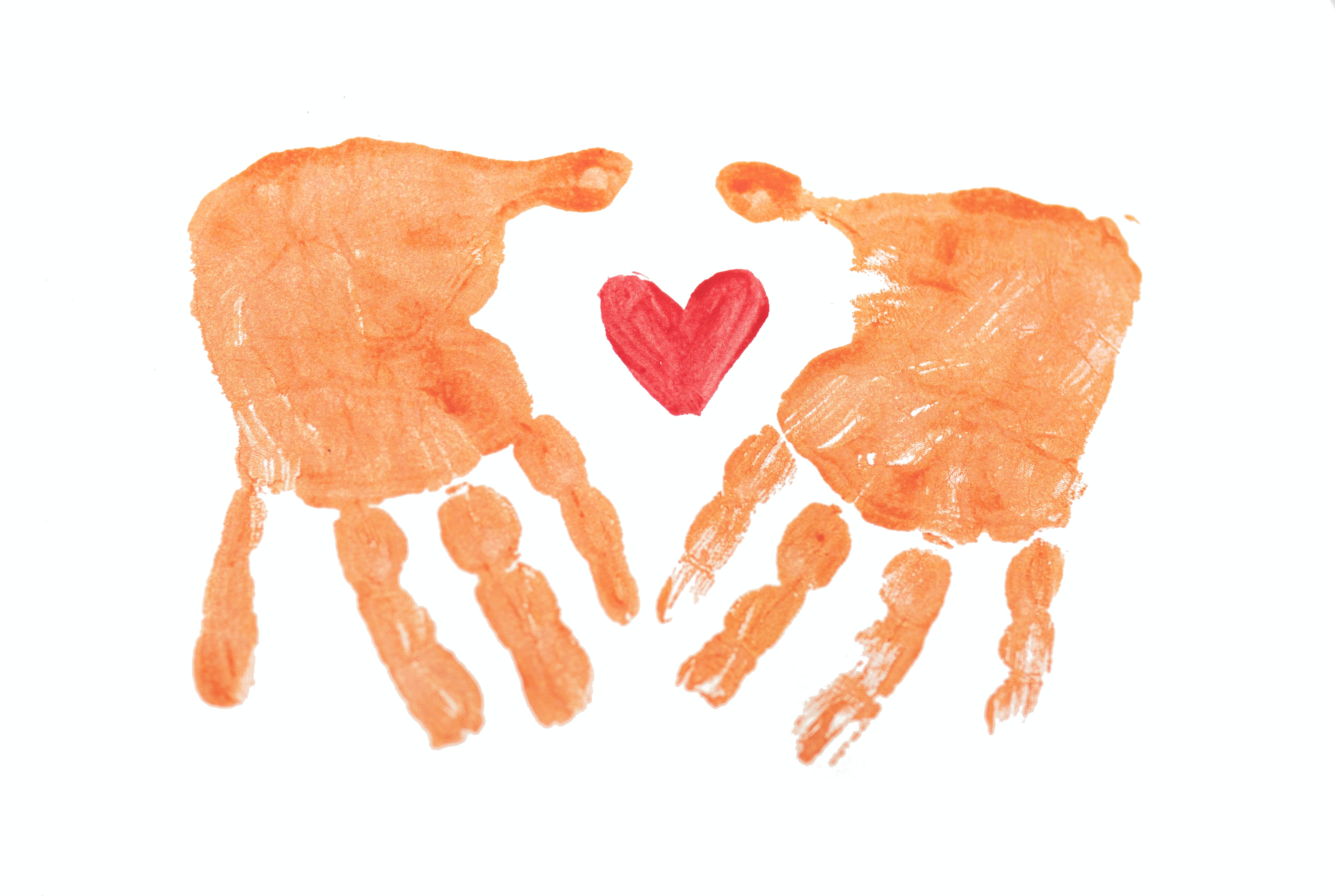 Two handprints with a heart in-between
